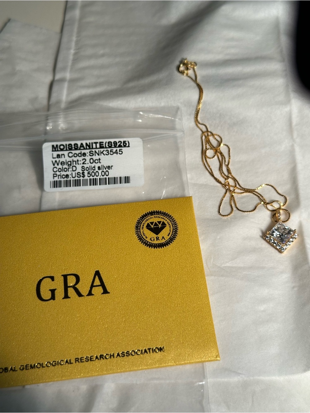 Gold over 925 Sterling Silver Moissanite on 18” chain. GRA Cert included